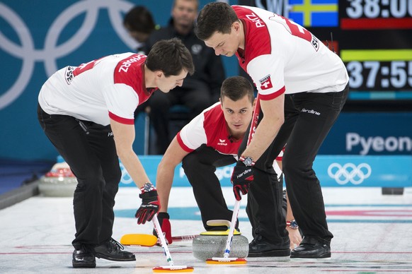 Benoit Schwarz, Valentin Tanner and Claudio Paetz of Switzerland, from left, during the men Curling round robin game between Switzerland and Sweden in the Gangneung Curling Center in Gangneung at the  ...