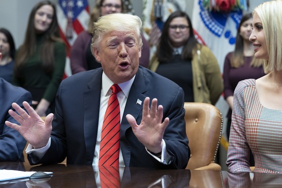 epa07931010 US President Donald J. Trump participates in a congratulatory call to NASA astronauts Jessica Meir and Christina Koch after they conducted the first all-female spacewalk outside of the Int ...