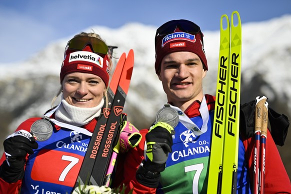 Silver medalists Amy Baserga of Switzerland, left, and teammate Niklas Hartweg, pose after the single mixed relay race at the IBU European Open Biathlon Championships, on Sunday, January 29, 2023, in  ...