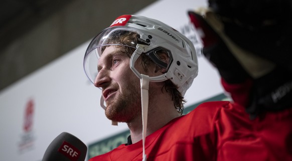 Janis Moser (CHE) speaks with journalists in the mixed zone after a training of team Switzerland in the practice rink in the Swiss Life Arena in Zuerich, Switzerland on Wednesday, 13. May 2026. (KEYST ...