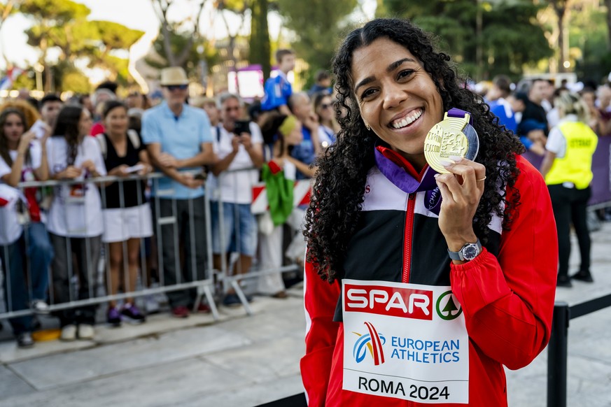 Gold medalist Mujinga Kambundji of Switzerland poses after the medals ceremony for the women&#039;s 200 meters at the European Athletics Championships, in the Olympic stadium, in Rome, Italy, Wednesda ...