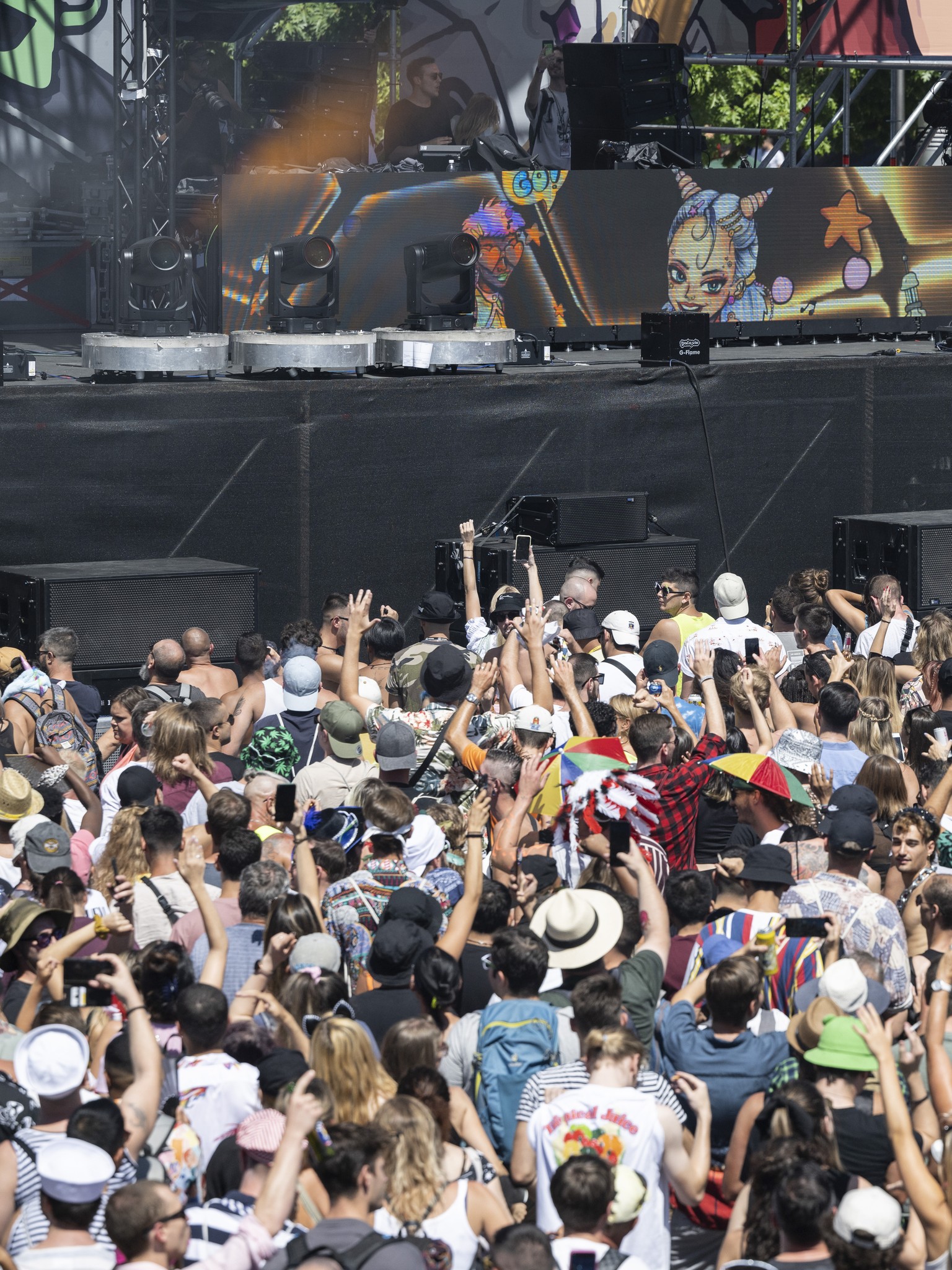 Thousands of participants dancing through the streets during the 29th Street Parade in the city center of Zurich, Switzerland, Saturday, August 13, 2022. The annual dance music event Street Parade run ...