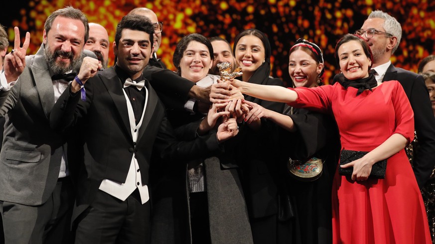 epa08260265 Cast and crew form the movie accepts the Golden Bear on behalf of Mohammad Rasoulof for the movie &#039;Sheytan vojud nadarad&#039; (There Is No Evil) during the Closing and Awards Ceremon ...