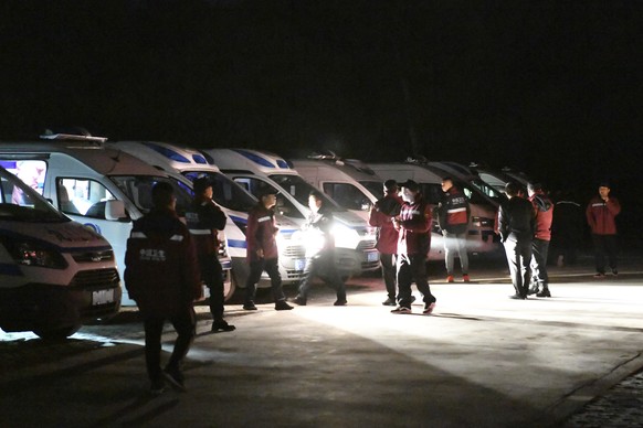 In this photo released by China&#039;s Xinhua News Agency, emergency personnel and vehicles wait on standby at the Yellow River Stone Forest tourist site in Baiyin in northwestern China&#039;s Gansu P ...