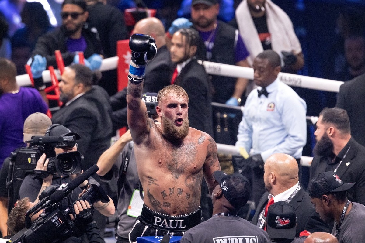 epa11489906 Jake 'El Gallo' Paul celebrates his victory against 'Platinum' Mike Perry during their Fear No Man eight round cruiserweight bout at Amalie Arena in Tampa, Florida, USA ...