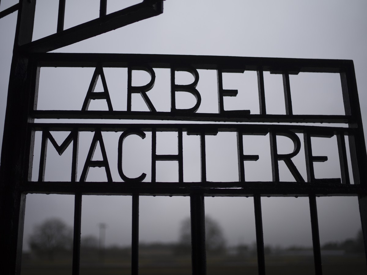 The gate of the Sachsenhausen Nazi death camp with the phrase 'Arbeit macht frei' (work sets you free) stands open in Oranienburg, about 30 kilometers (18 miles) north of Berlin, Germany, Tu ...