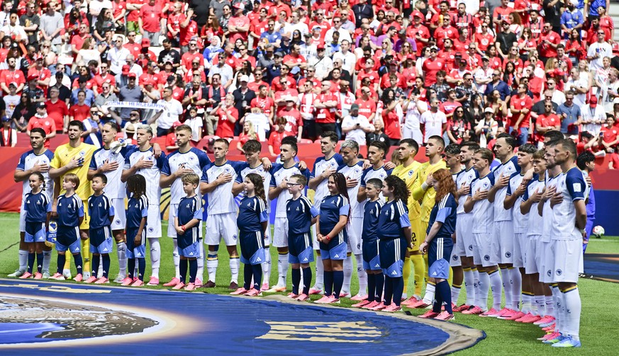 epa13033914 The team of Bosnia and Herzegovina listen to the national anthem before the FIFA World Cup 2026 group stage match Canada against Bosnia and Herzegovina, in Toronto, Canada, 12 June 2026. E ...