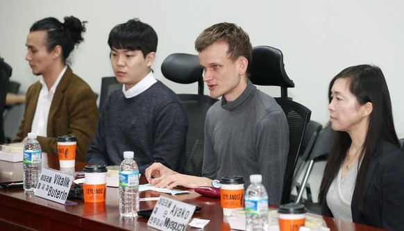 epa06641267 Vitalik Buterin (2-R), the creator of the ethereum cryptocurrency, speaks during a forum on virtual currency, blockchain and the distributed economy at the National Assembly in Seoul, Sout ...