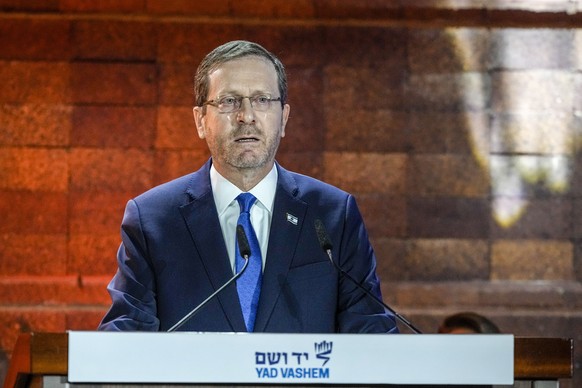 TILE - Israeli President Isaac Herzog delivers a speech at the opening ceremony of the Holocaust Martyrs and Heroes Remembrance Day at the Yad Vashem Holocaust Museum in Jerusalem, Monday, April ...