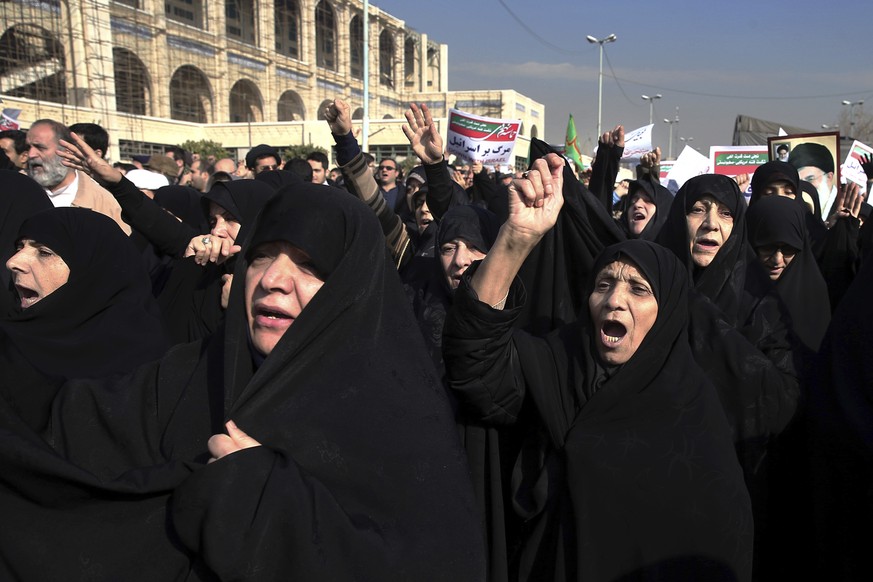 Iranian protesters chant slogans at a rally in Tehran, Iran, Saturday, Dec. 30, 2017. Iranian hard-liners rallied Saturday to support the country&#039;s supreme leader and clerically overseen governme ...