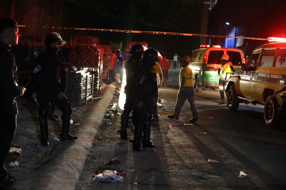 epa10642664 Members of the police and first responders guard area after a stampede at the Cuscatlán Stadium, during to a soccer match in San Salvador, El Salvador, 20 May 2023. At least nine people di ...