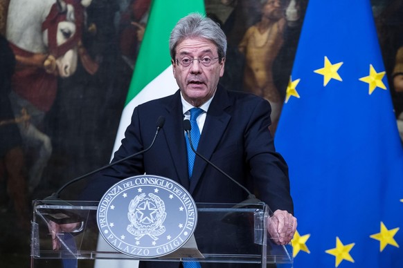 Italian Prime Minister Paolo Gentiloni talks about the shooting in Macerata, Italy, as he holds a press conference at Palazzo Chigi in Rome Saturday, Feb. 3, 2018. A lone gunman opened fire on foreign ...