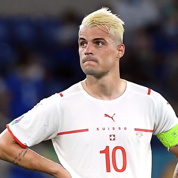 epa09278329 Granit Xhaka of Switzerland reacts after the UEFA EURO 2020 group A preliminary round soccer match between Italy and Switzerland in Rome, Italy, 16 June 2021. EPA/Ettore Ferrari / POOL (RE ...