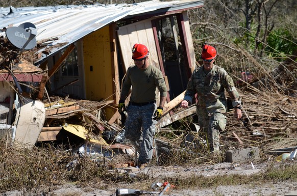 epa07090205 A handout photo made available by the Florida National Guard on 13 October 2018 shows damage in the city of Port St. Joe, Florida, USA, 12 October 2018, after it was hit hard by Hurricane  ...