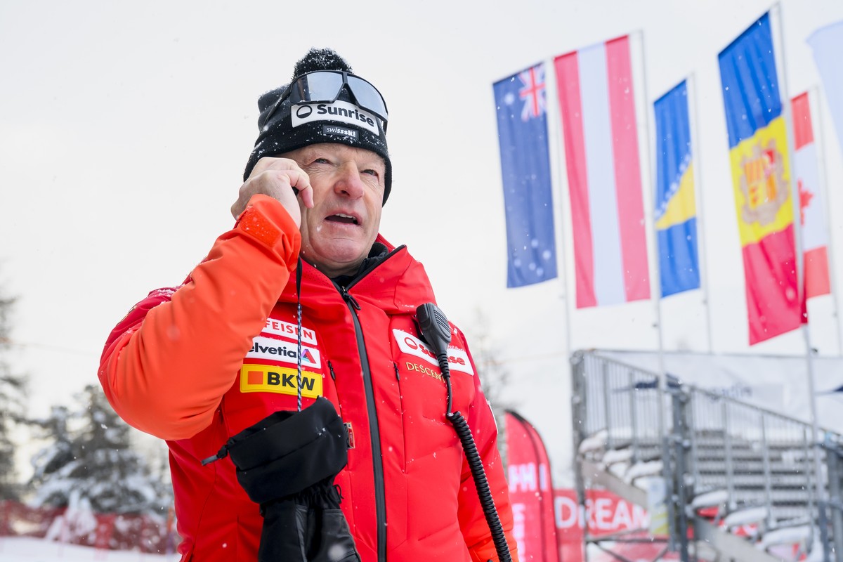 Hans Flatscher, Swiss-Ski Alpine director, uses his phone after the cancellation of the women's Super-g race at the Alpine Skiing FIS Ski World Cup, in St. Moritz, Switzerland, Sunday, December 1 ...