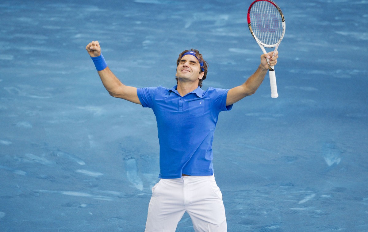 Roger Federer from Switzerland celebrates after defeating Tomas Berdych from the Czech Republic during their singles men's final tennis match at the Madrid Open tennis tournament in Madrid Sunday ...