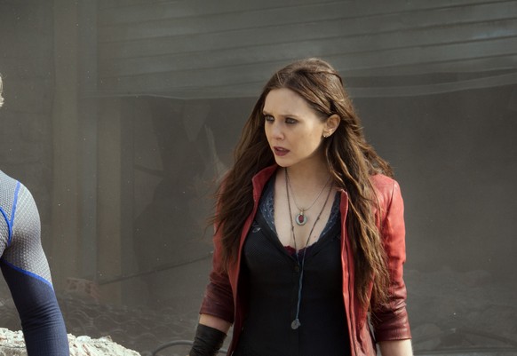 This photo provided by Disney/Marvel shows, Aaron Taylor-Johnson, left, as Quicksilver/Pietro Maximoff , and Elizabeth Olsen as Scarlet Witch/Wanda Maximoff, in a scene from the film, &quot;Avengers:  ...