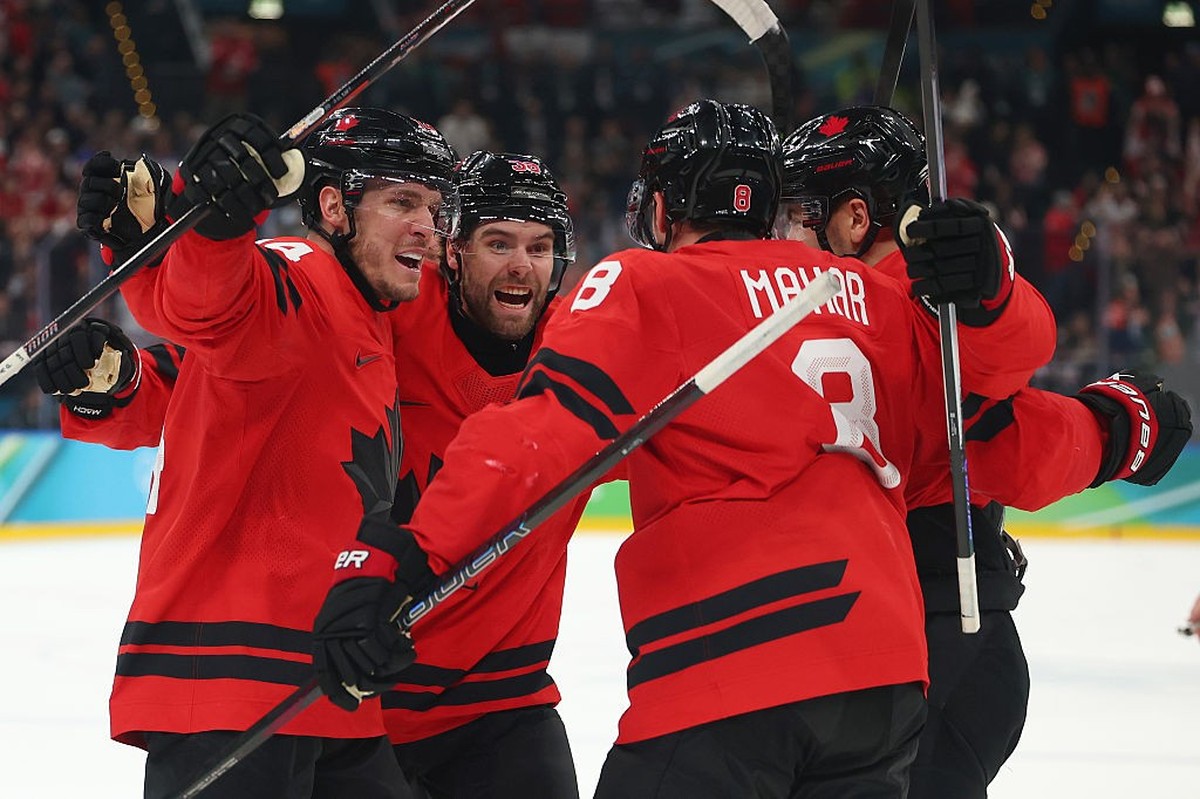 MILAN, ITALY - FEBRUARY 22: Cale Makar #8 of Team Canada celebrates with teammates after scoring a goal in the second period during the Men's Gold Medal match between Canada and the United States ...