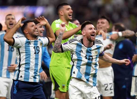 Argentina v France - FIFA World Cup, WM, Weltmeisterschaft, Fussball 2022 - Final - Lusail Stadium Argentina s Lionel Messi celebrates victory over France to win the FIFA World Cup with former player  ...