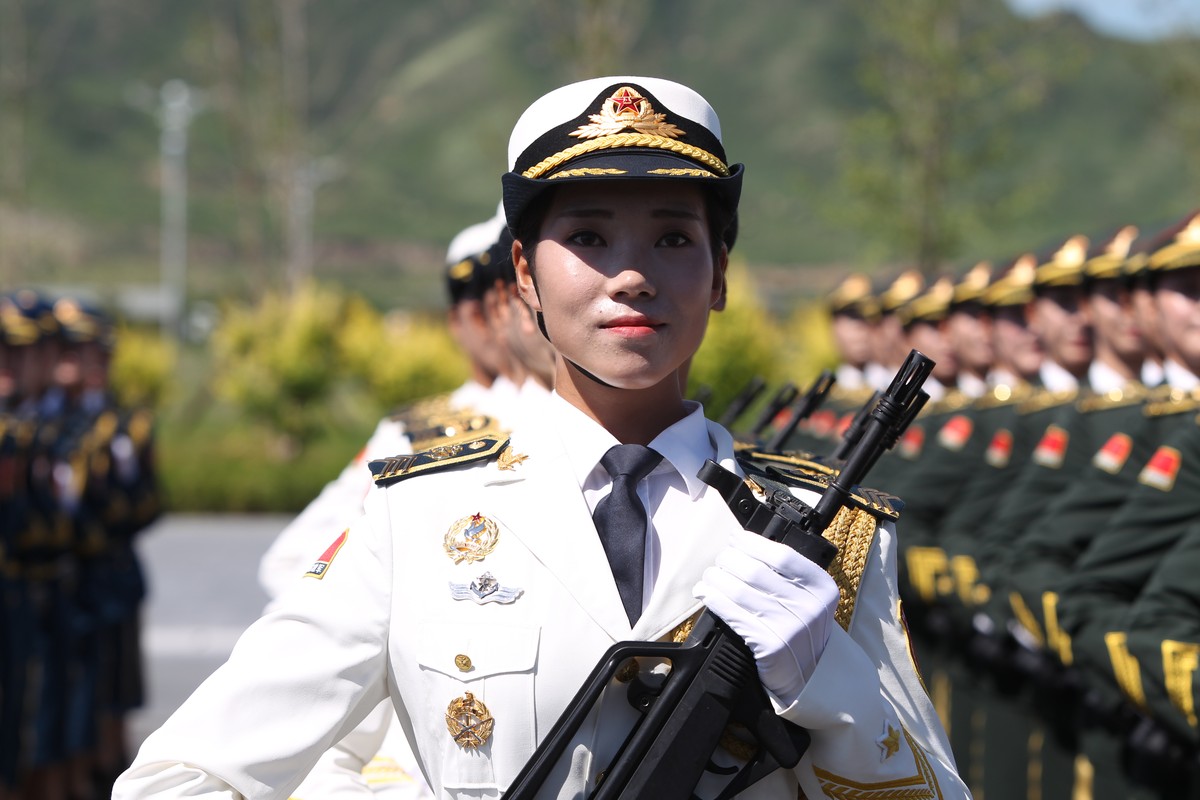 BEIJING, CHINA - AUGUST 22: (CHINA OUT) A female soldier from the Chinese People's Liberation Army attends a training session for the September 3 military parade to mark the 70th anniversary of t ...