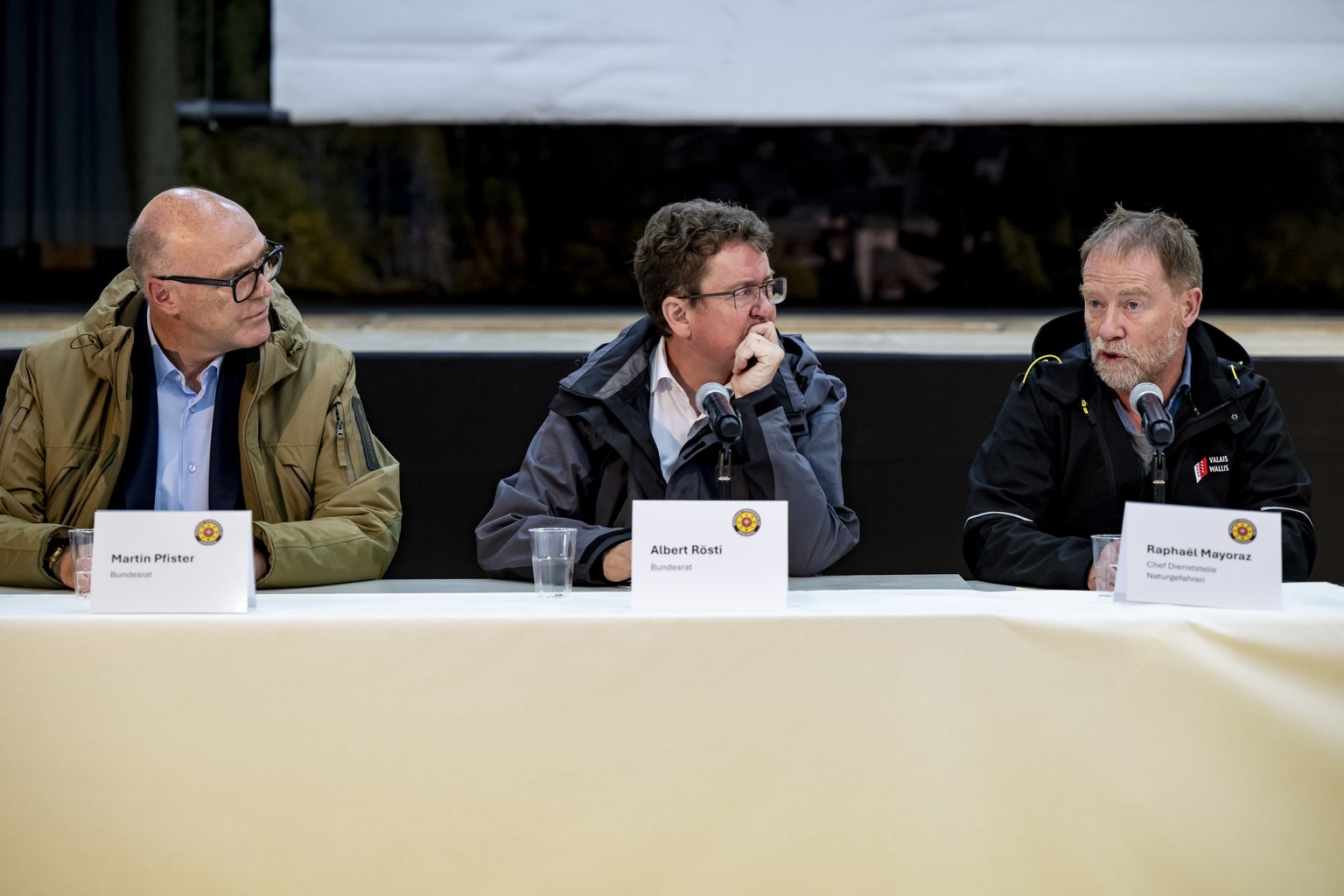 KEYPIX - Swiss Federal Councillor Martin Pfister, Swiss Federal Councillor Albert Roesti, Raphael Mayoraz, Head of the Natural Hazards Service of Canton of Valais, from left to right, speak during a p ...