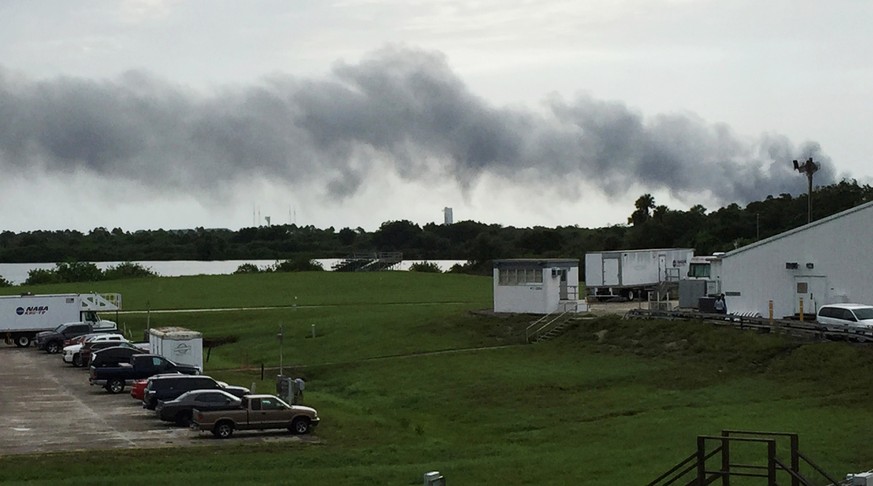 Smoke rises from a SpaceX launch site Thursday, Sept. 1, 2016, at Cape Canaveral, Fla. NASA said SpaceX was conducting a test firing of its unmanned rocket when a blast occurred. (AP Photo/Marcia Dunn ...