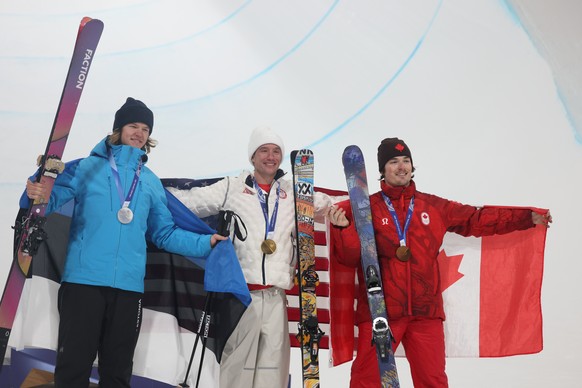 epa12763523 Silver medalist Henry Sildaru from Estonia, Gold medalist Alex Ferreira from the USA and Bronze medalist Brendan Mackay from Canada celebrate in the podium of the Men's Freeski Halfpi ...