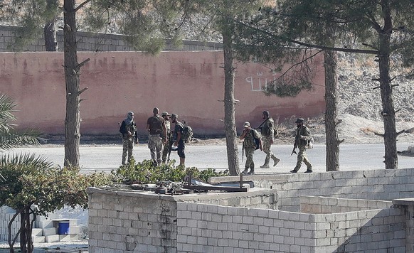 epa07917985 Turkish-backed Syrian fighters in Syria&#039;s Tal Abyad town for a military operation in Kurdish areas, in Akcakale district in Sanliurfa, Turkey, 13 October 2019. Turkey has launched an  ...