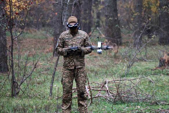 Training of FPV drone pilots from Ukraine s Khartiia Brigade A pilot from the 13th Khartiia Operational Brigade of Ukraine s National Guard flies an FPV drone during a training session to practice fli ...