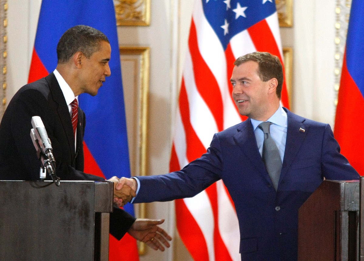 FILE - U.S. President Barack Obama, left, and his Russian counterpart Dmitry Medvedev, right, shake hands at a news conference at the Prague Castle in Prague, Czech Republic,, April 8, 2010, after sig ...