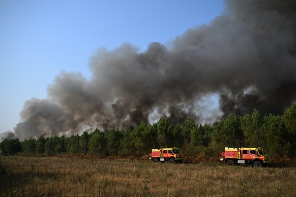 Firefighters work to extinguish a fire in the forest near Blagon, during wildfires in southwestern France, Wednesday, July 29, 2026. (AP Photo/Emma Da Silva)
France Wildfires