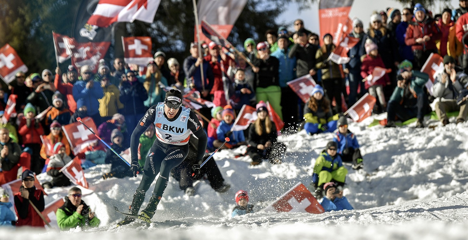 Dario Cologna of Switzerland skis to win the men&#039;s 15 kilometer cross country pursuit race at the Tour de Ski in Lenzerheide, Switzerland, Monday, Jan. 1, 2018. (Peter Schneider/Keystone via AP)