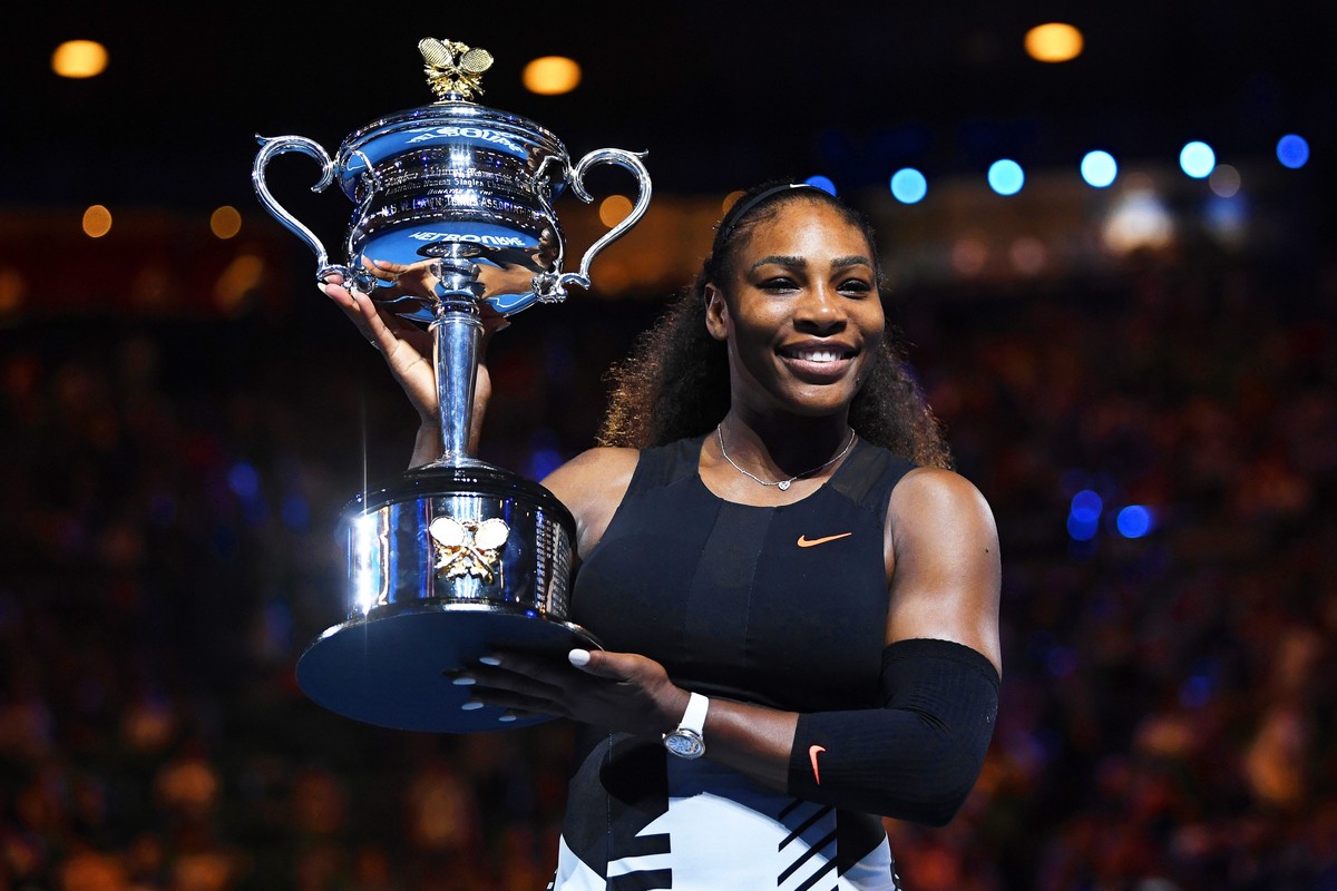 epa05756209 Serena Williams of the USA poses with her trophy after defeating her sister Venus Williams in their women's final at the Australian Open Grand Slam tennis tournament in Melbourne, Vic ...