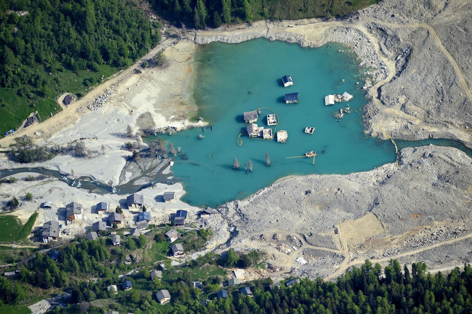 The massive landslide and debris field caused by the collapse of the Birch Glacier, which unleashed tons of rock and ice into the Loetschental valley pictured 1 year after the landslide destroyed the  ...