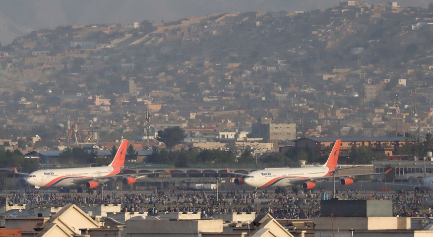 epa09416574 A view of Hamid Karzai International Airport after Taliban took control of Kabul, Afghanistan, 16 August 2021. Several people were reportedly killed at Kabul airport on 16 August as Afghan ...