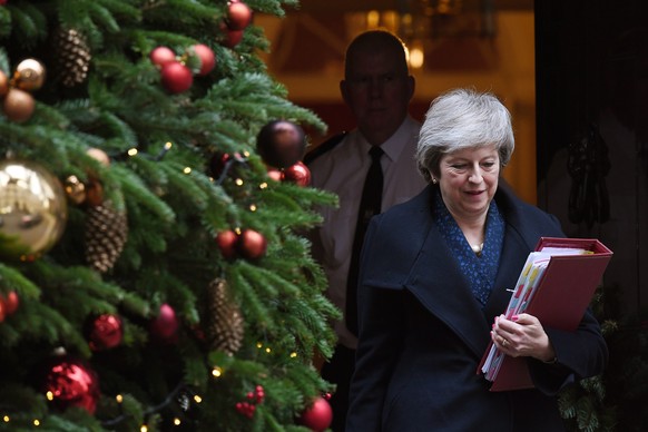 epa07225485 British Prime Minister Theresa May leaves 10 Downing street in London, Britain, 12 December 2018, to attend Prime Ministers Questions in the Houses of Parliament. Theresa May will face a c ...