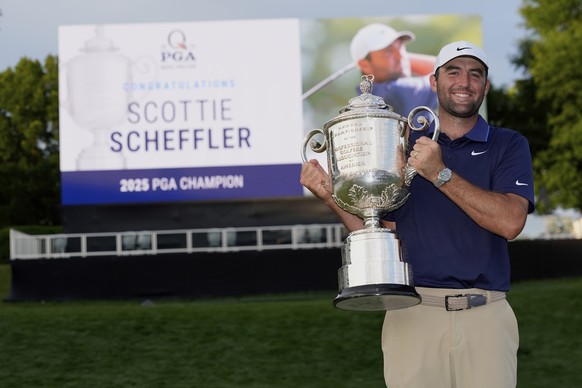 Scottie Scheffler poses with the Wanamaker trophy after winning the PGA Championship golf tournament at the Quail Hollow Club, Sunday, May 18, 2025, in Charlotte, N.C. (AP Photo/David J. Phillip)
PGA  ...