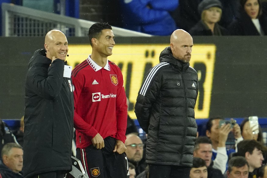 Manchester United&#039;s Cristiano Ronaldo stands next to Manchester United&#039;s head coach Erik ten Hag, right, waiting to replace teammate Anthony Martial during the Premier League soccer match be ...