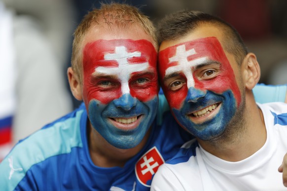 Slovakia's fans smile prior to the Euro 2016 round of 16 soccer match between Germany and Slovakia, at the Pierre Mauroy stadium in Villeneuve d'Ascq, near Lille, France, Sunday, June 26, 2016. (AP Photo/Frank Augstein)