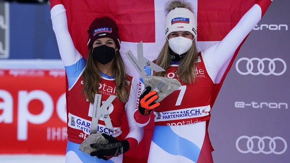 From left, second placed Switzerland&#039;s Jasmine Flury and the winner Switzerland&#039;s Corinne Suter, celebrate after an alpine ski, women&#039;s World Cup downhill in Garmisch-Partenkirchen, Ger ...
