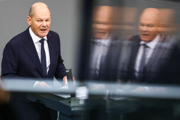 epa11718331 German Chancellor Olaf Scholz delivers a speech at the German Parliament Bundestag in Berlin, Germany, 13 November 2024. German Chancellor Scholz delivered a government statement on the cu ...