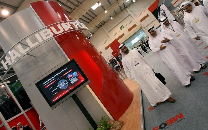 epa06465315 (FILE) - Visitors walk by the Halliburton stand in the 15th Society of Petroleum Engineers Middle East Oil &amp; Gas Show and Conference (MEOS 2007) in Manama 12 March 2007. Halliburton on ...