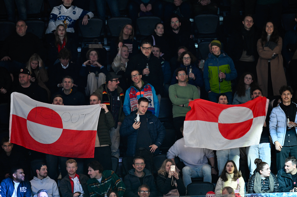 Winter Olympics - Greenland Flag With ICE OUT Slogan Fans of Danish Team show flag of Greenland with ICE OUT slogan written on it during the men s preliminary round Group C Ice Hockey match between US ...