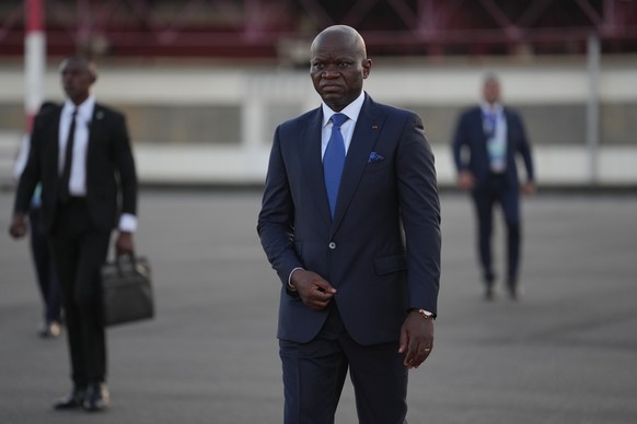 Gabon's President Brice Oligui Nguema waits to welcome France's President Emmanuel Macron at the Leon-Mba International Airport in Libreville, Gabon, Sunday, Nov. 23, 2025. (AP Photo/Thibaul ...