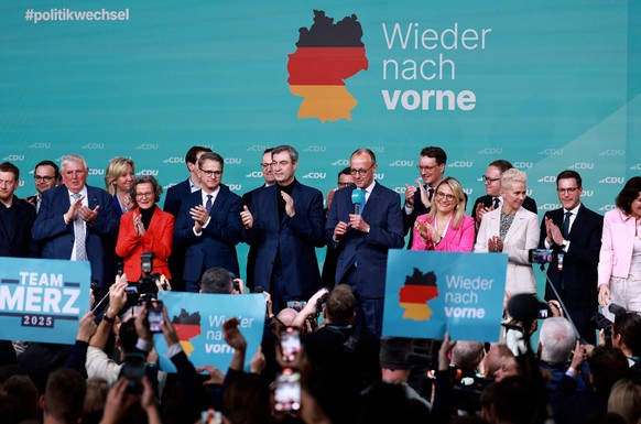 epa11919272 Chairman of Germany's Christian Democratic Union (CDU) Friedrich Merz (C) and and his party colleagues react during the Christian Democratic Union (CDU) election event in Berlin, Germ ...