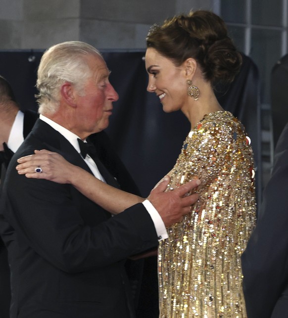 FILE - In this Tuesday, Sept. 28, 2021 file photo, Britain&#039;s Prince Charles, left, speaks with Kate, the Duchess of Cambridge as they arrive for the World premiere of the new film from the James  ...