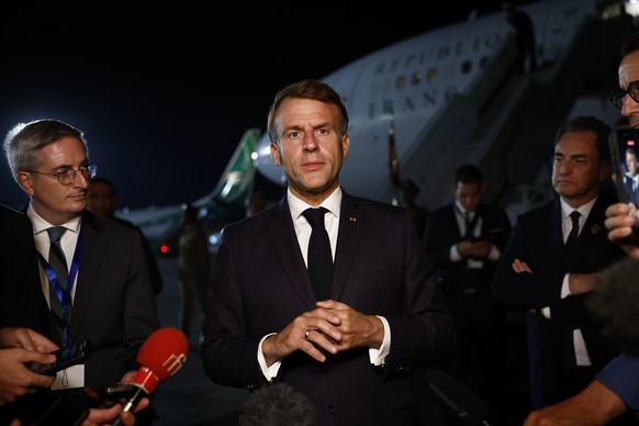 epa12451656 French President Emmanuel Macron answers to journalists as he leaves the Gaza Peace Summitin Sharm El-Sheikh, Egypt, 13 October 2025. US President Donald Trump alongside Egypt&#039;s Presi ...