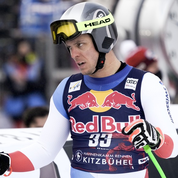 Switzerland's Ralph Weber at the finish area of an alpine ski, men's World Cup downhill, in Kitzbuehel, Austria, Sunday, Jan. 23, 2022. (AP Photo/Giovanni Auletta)