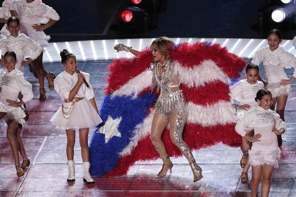 Jennifer Lopez and daughter Emme Maribel Muniz perform during halftime of the NFL Super Bowl 54 football game Sunday, Feb. 2, 2020, in Miami Gardens, Fla. (AP Photo/Charlie Riedel)