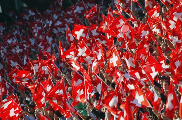 Swiss fans cheer for their team during the EURO 2004 qualifyer between Switzerland and Ireland, at St. Jakob Park in Basel, Switzerland, Saturday, October 11, 2003. (KEYSTONE/Fabrice Coffrini)